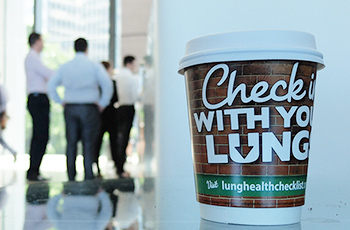 lung foundation advertisied coffee cup near corporate professionals