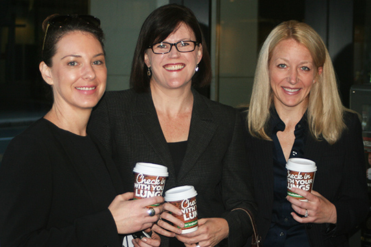 corporate women holding lung foundation campaign cups